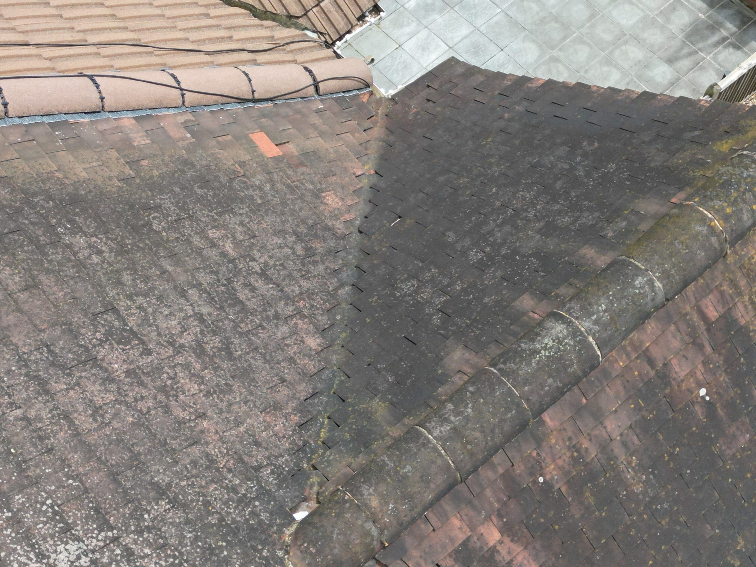 Roof survey image of a semi detached house with defective tiles.