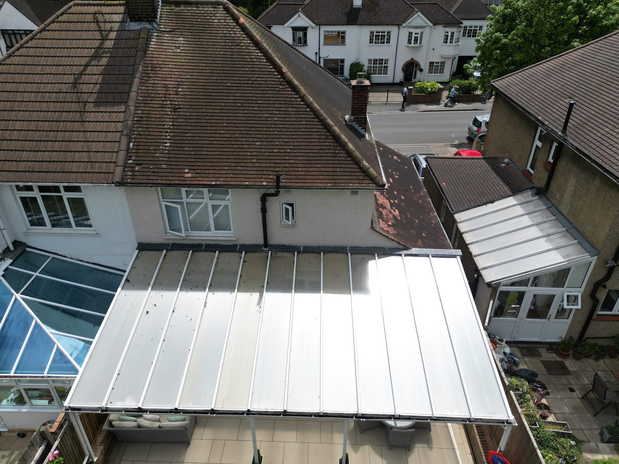 Roof survey image of a semi detached house with defective tiles.